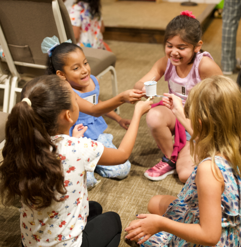 kids in children's church haveing fun together.